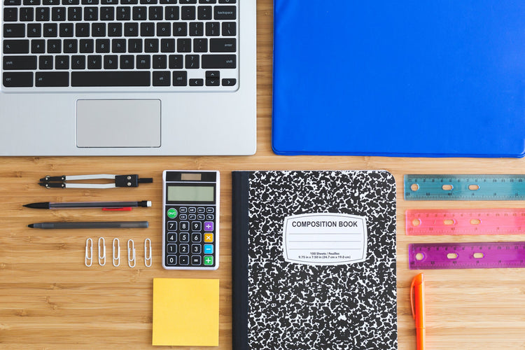 office and school supplies, laptop, notebook, calculator, pens and pencils