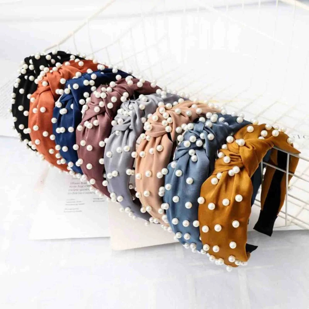 Elegant Pearl Headbands on a rack