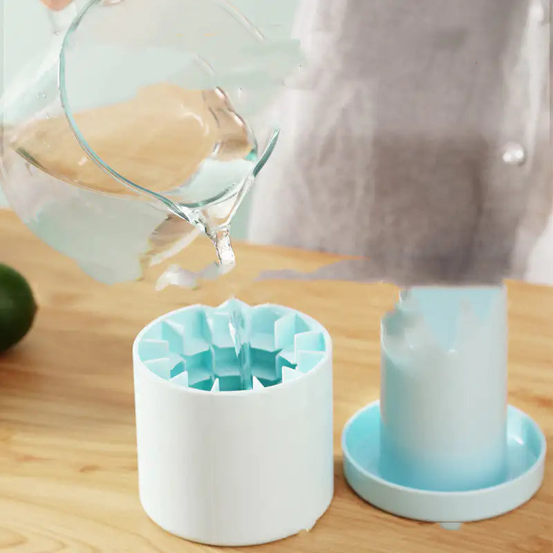 man pouring water into the Cylinder Ice Cube Mold