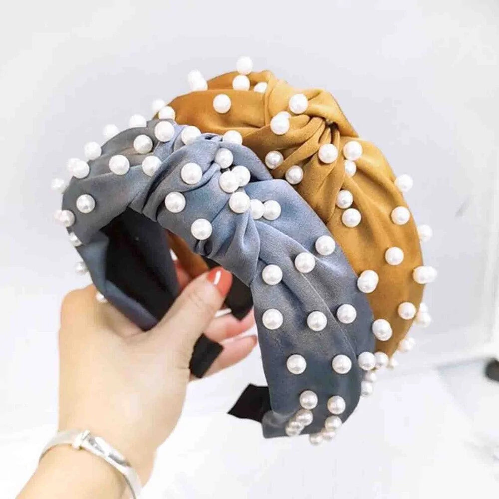 person holding Elegant Pearl Headbands