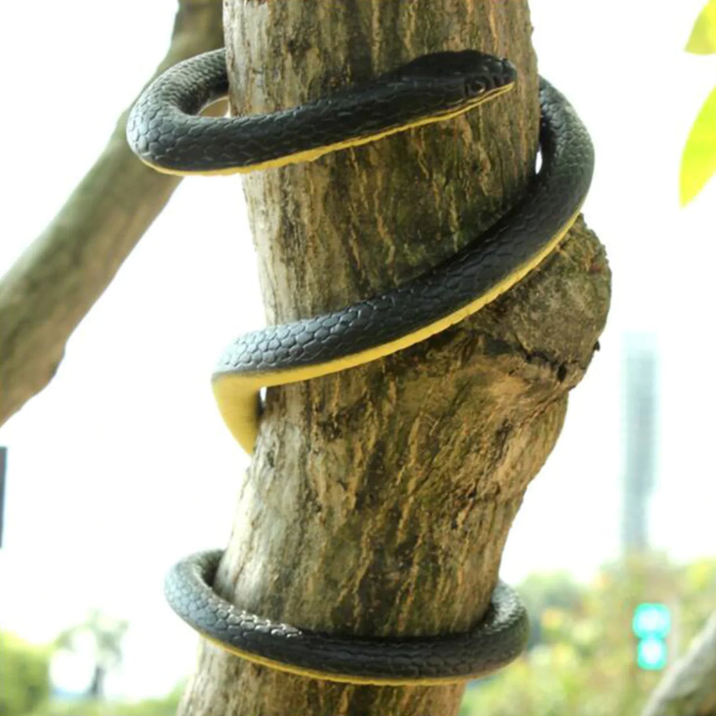 Realistic Rubber Snake coiled around a tree