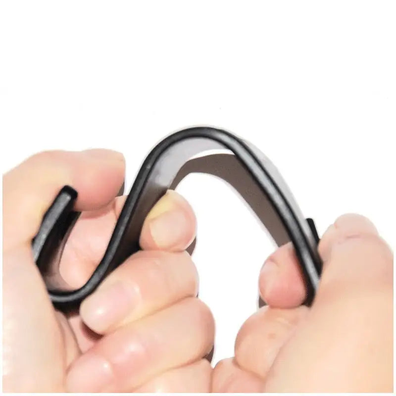 person holding a Car Seat Headrest Hook