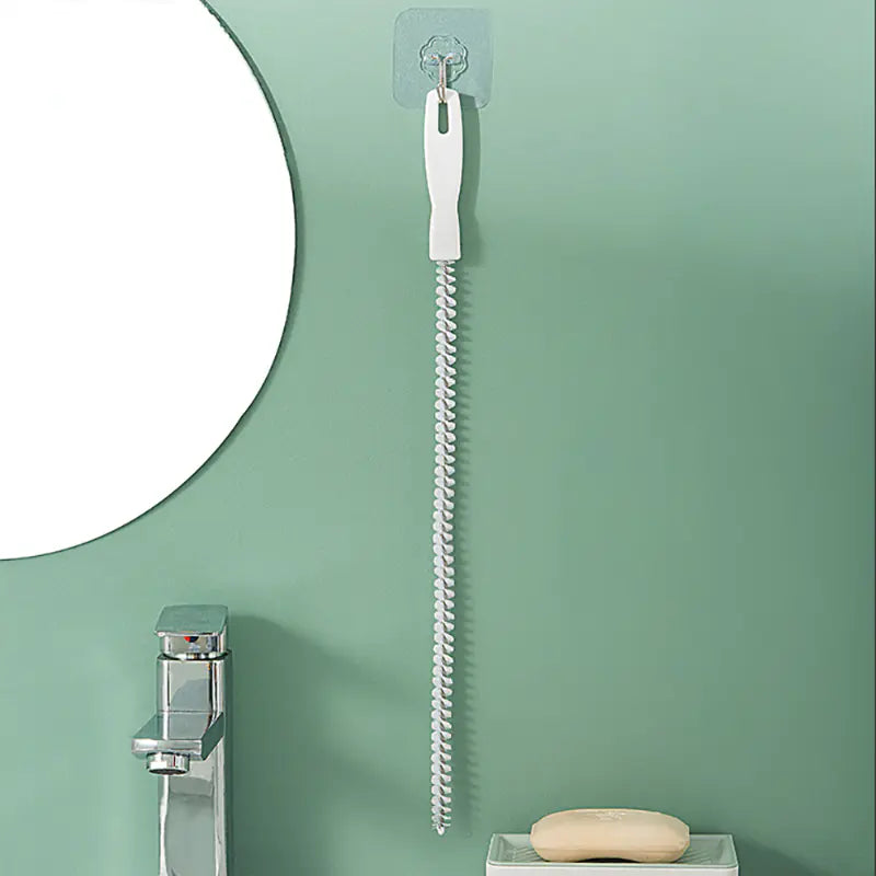 Flexible Drain Cleaning Brush hanging on a wall