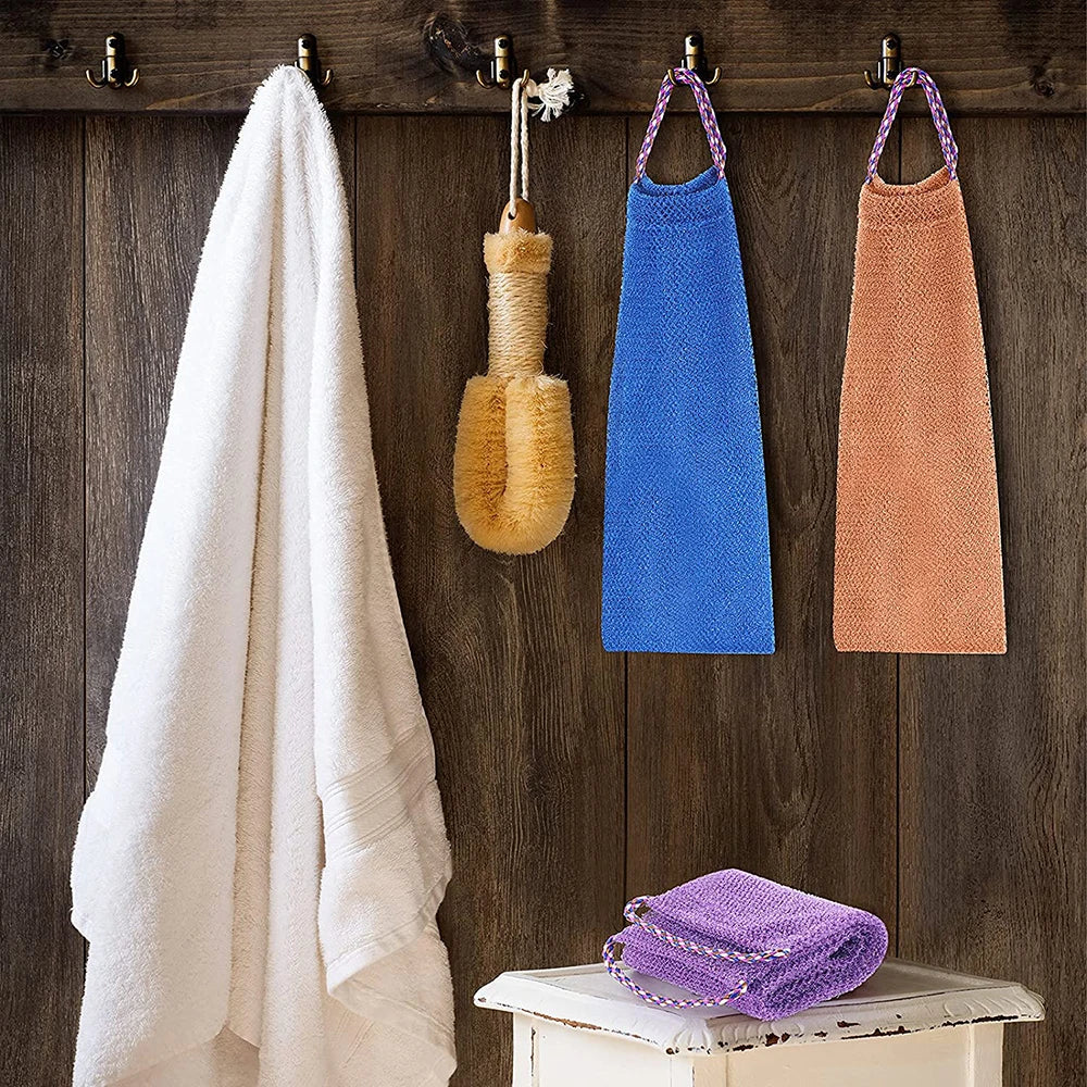African Exfoliating Sponge hanging with a towel on a rack