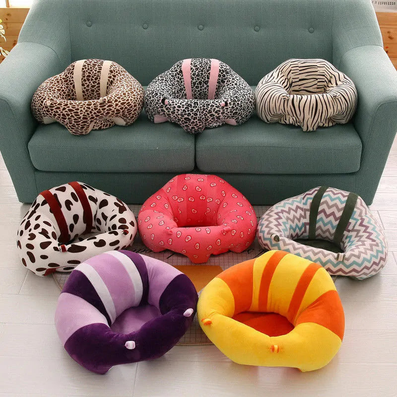 Plush Baby Support Seat on a couch and the floor