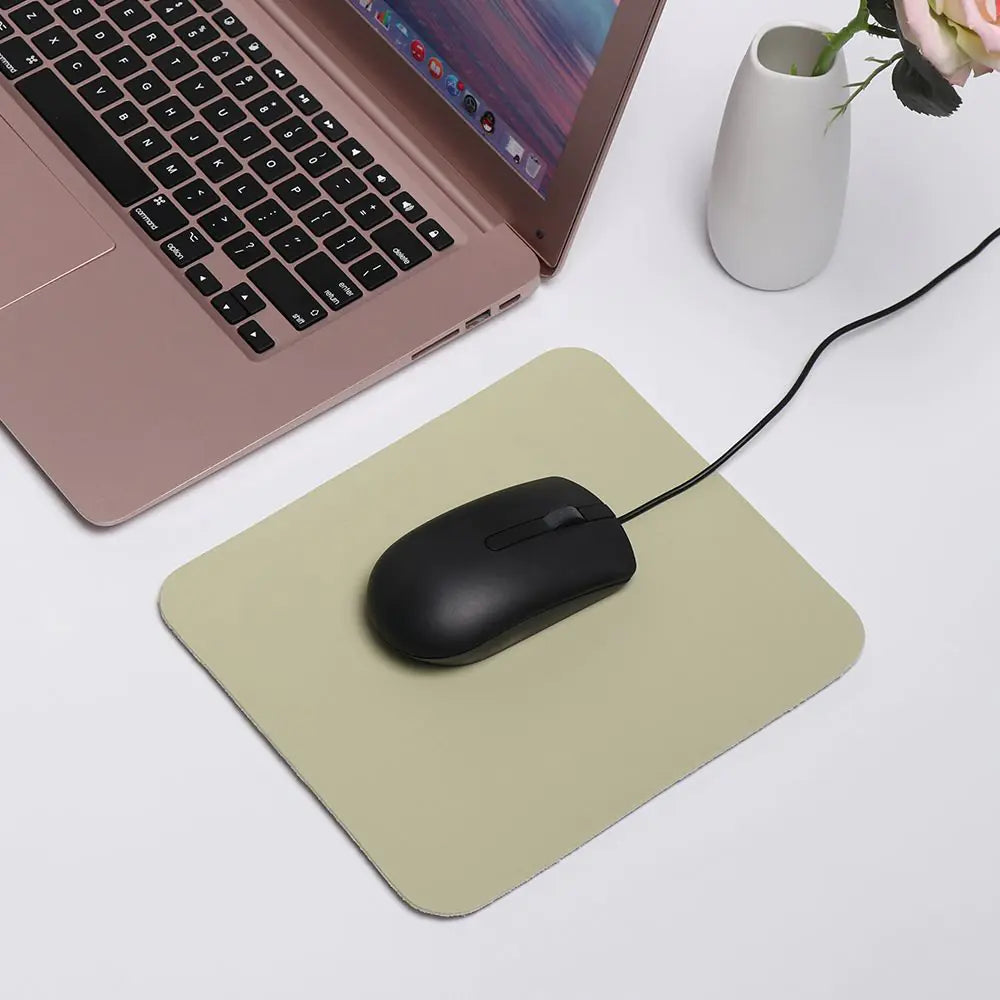mouse resting on a green Waterproof Desk Mousepad