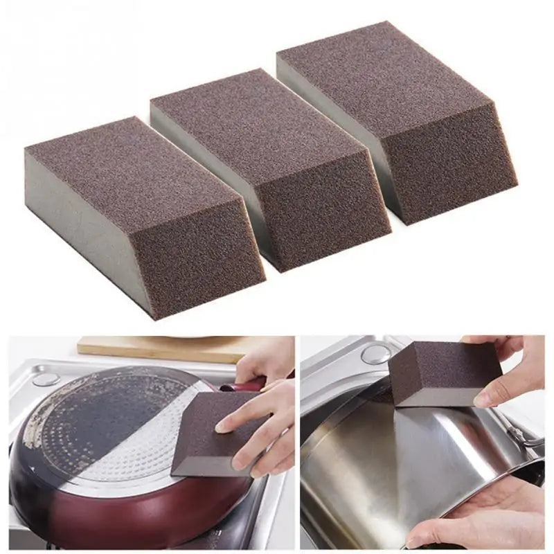 person scrubbing the base of a pot using the Magic Eraser Sponge