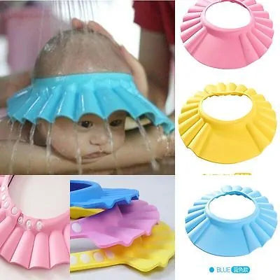 baby using the blue Kids Bath Visor Cap