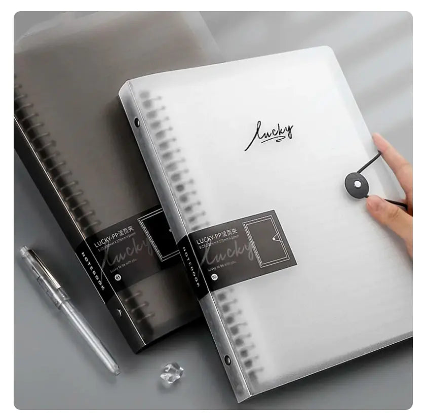 person holding Clear Cover Notebook