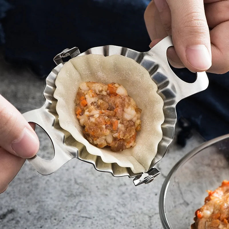 person using a Stainless Steel Dumpling Mold to close a filled dumpling