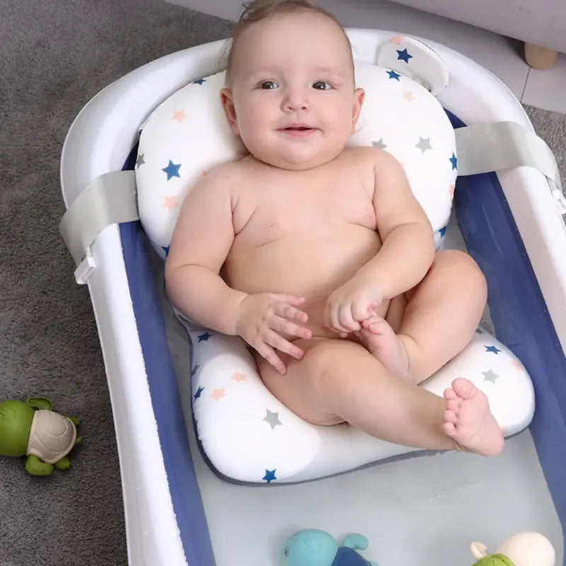 baby in a Foldable Baby Bath Seat