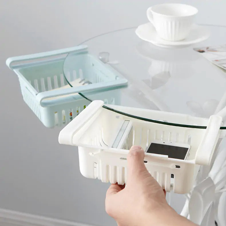 Refrigerator Storage Drawer being pushed onto a glass table